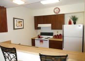 Thumbnail 6 of 9 - Kitchen with breakfast bar at Cambridge Square Bedford