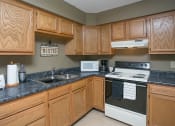 Thumbnail 7 of 12 - Clubhouse Kitchen at Carriage House Virginia Beach