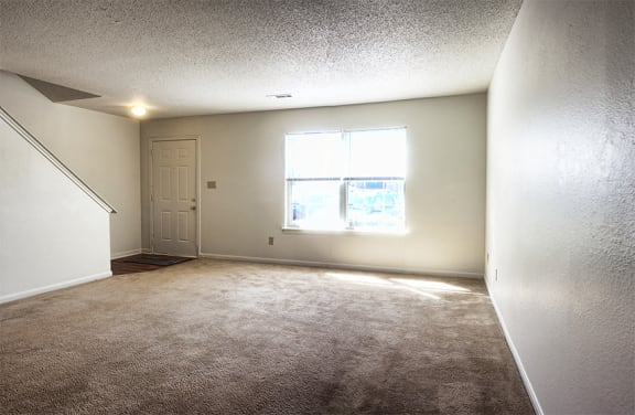 Living Room with carpet and connected to dining room at Bethabara Pointe