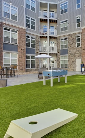 The Edison at Wheat Ridge Apartments in Wheat Ridge, Colorado Courtyard with Corn Hole
