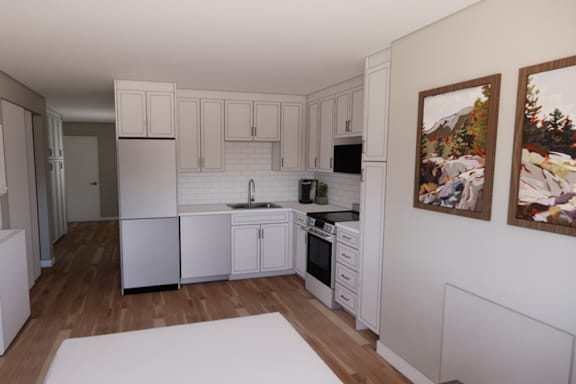 A kitchen with white cabinets and appliances.