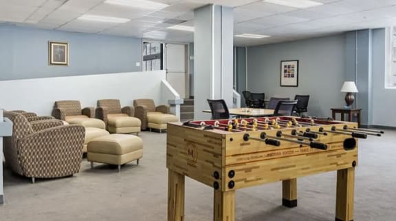 a room filled with lots of tables and chairs