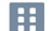 A simple icon of a building with four windows.