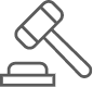 A gavel is striking a block on a desk.