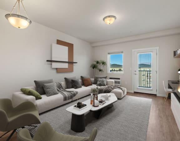 A living room with a white couch, a coffee table, and a chair.