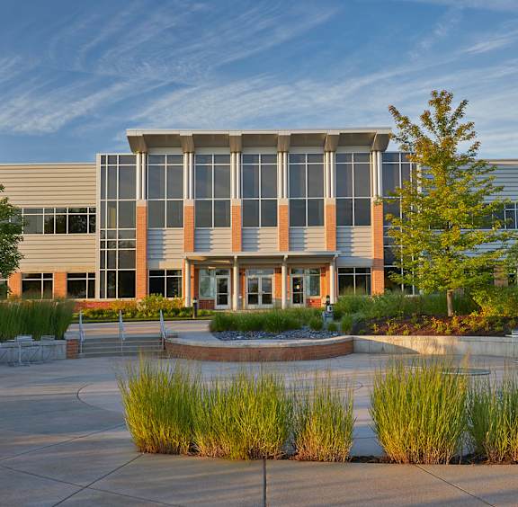 a building with a fountain in front of it at The Century at Purdue Research Park-Student, West Lafayette Indiana