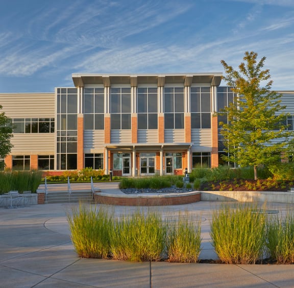 a building with a fountain in front of it at The Century at Purdue Research Park-Student, West Lafayette Indiana