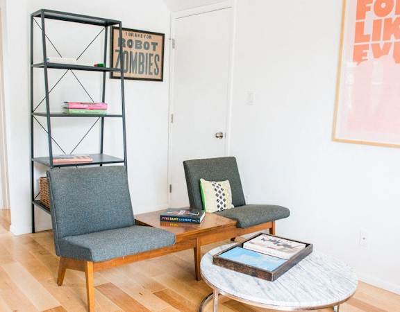 a living room with two chairs and a coffee table