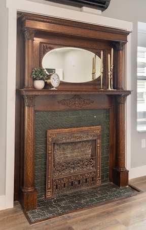A fireplace with a mirror above it and a red carpet in front at ONE18 West Street Residential Apartments, Nevada, 89501