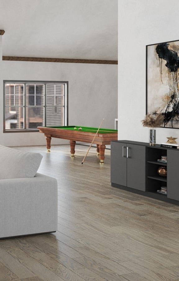 a living room with a pool table and a couch