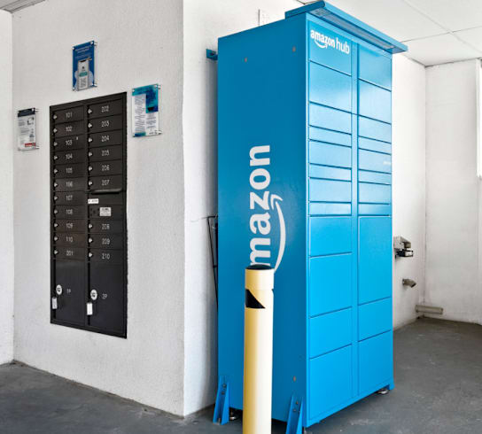 A blue Amazon storage unit sits in a white room.