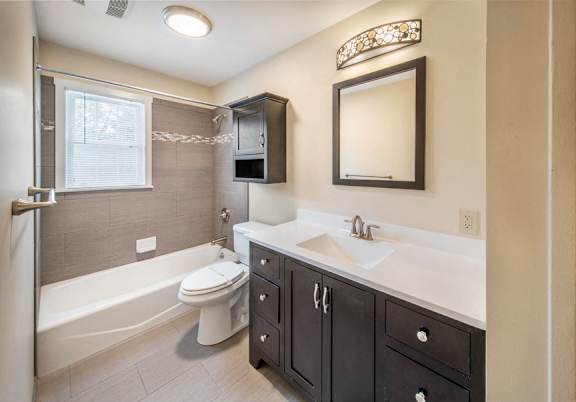 Bath tub area with sink and vanity at Rivercrest Apartments, New Jersey, 08854