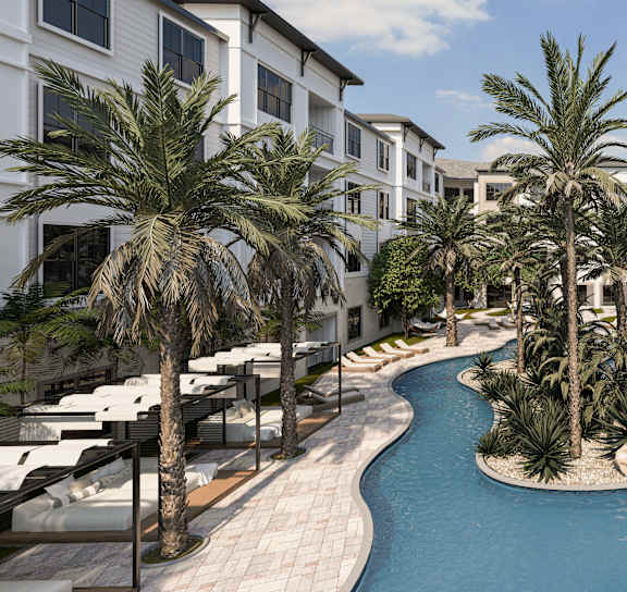 A pool surrounded by palm trees and white buildings.