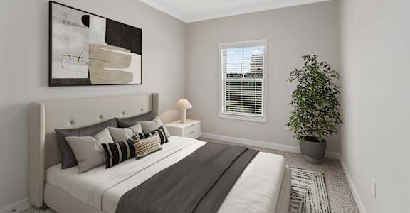 a bedroom with a large bed and a ceiling fan