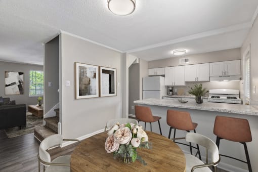 a dining room and kitchen in a 555 waverly unit