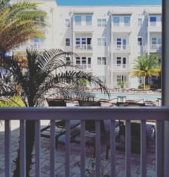 a view of a pool from a balcony at Lake Lofts at Deerwood, Florida