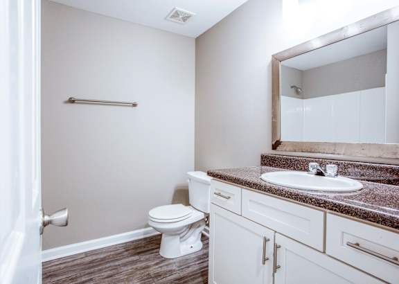 a bathroom with a toilet sink and bathtub