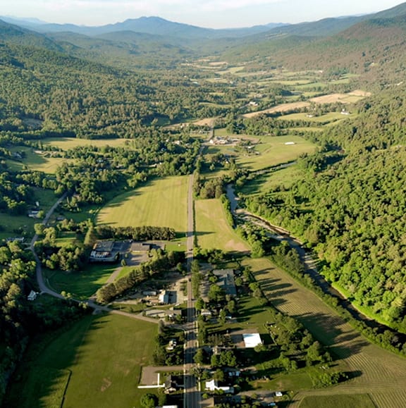 A small town nestled in the valley of a mountain range.