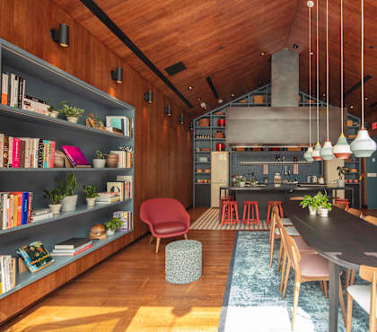 A modern kitchen with a wooden ceiling and a long black table with chairs.
