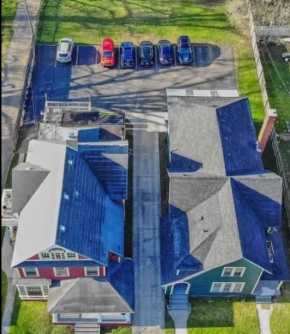 an aerial view of a building with a blue roof