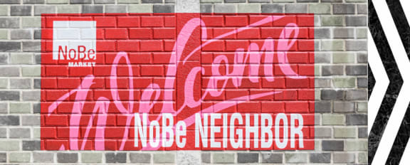 NoBe Market Apartments Welcome Sign Painted on Brick Wall