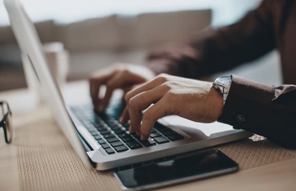 typing on laptop