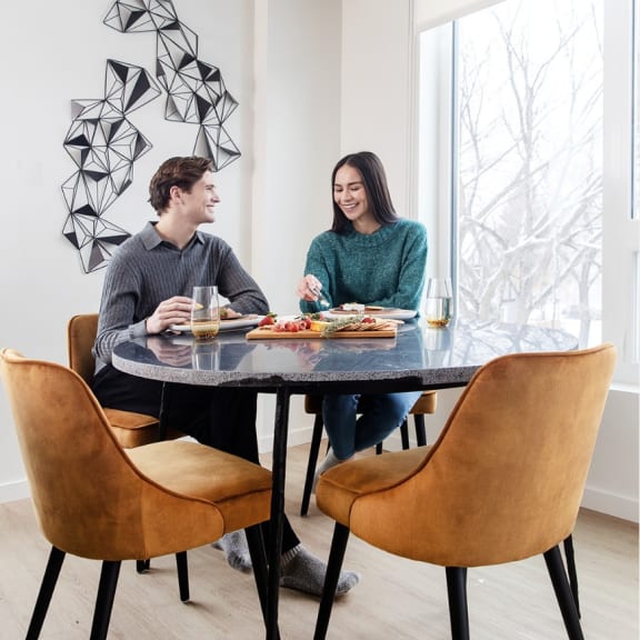 a man and a woman sitting at a table at Southpark on Whyte, Edmonton, Alberta, T6E 3S3