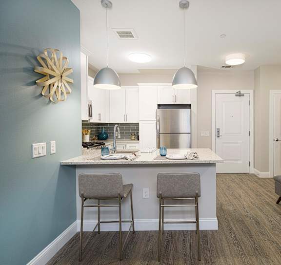 Kitchen with Bar and chairs at Viva Lakeshore, Massachusetts