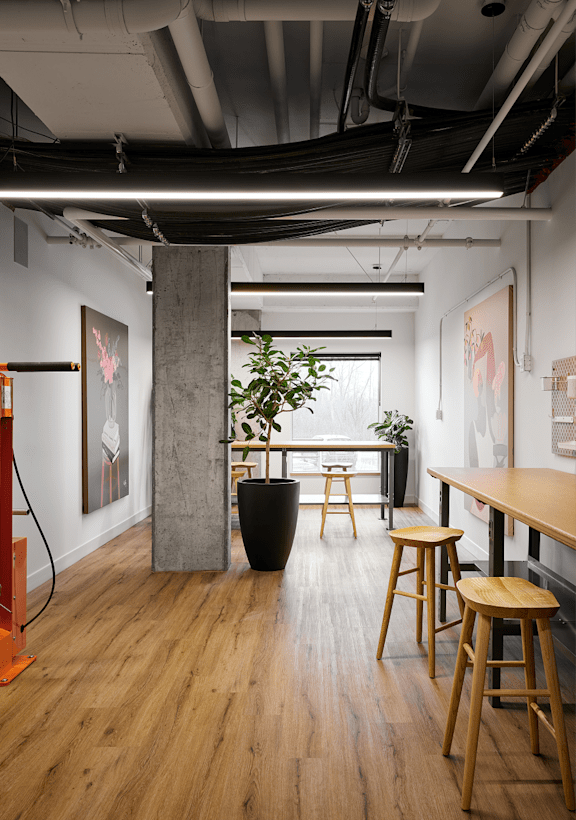A room with wooden floors and a large window.