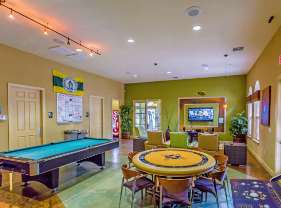 Game room lounge with seating and table