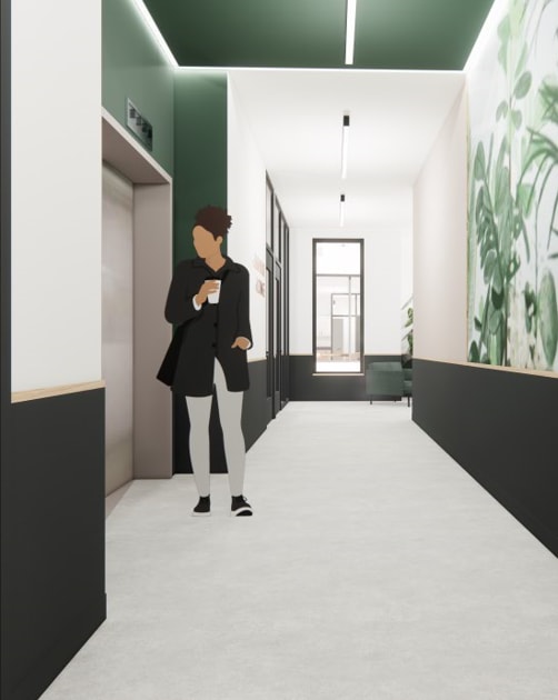 a woman standing in a hallway with a painting on the wall