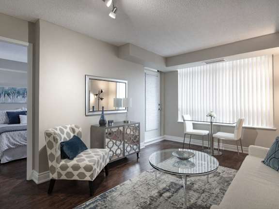 an open living room and dining room with a table and chairs