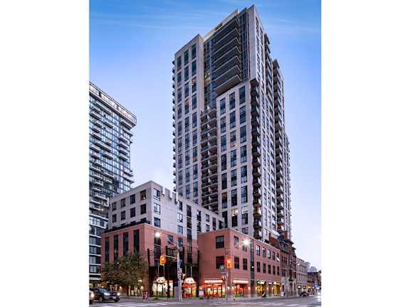 a rendering of a tall building on the corner of a city street