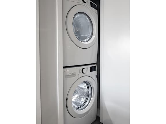 a washing machine and a dryer in a wall