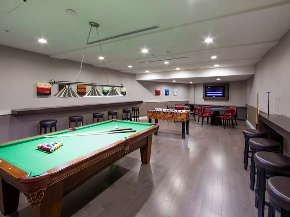 we have a large games room with a pool table and a foosball table