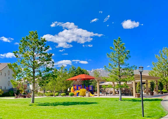 Green area with a gazebo and a house in the background at Sharlands Terrace Apartments, Apartments, Reno, NV
