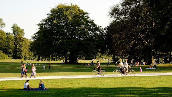 A group of people are enjoying a sunny day in the park.