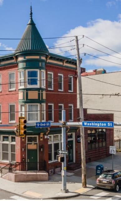 a building on the corner of a city street