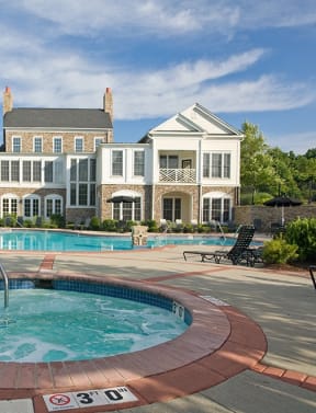 a hot tub with a fountain in front of a large house at Harper's Crossing, Langhorne, PA