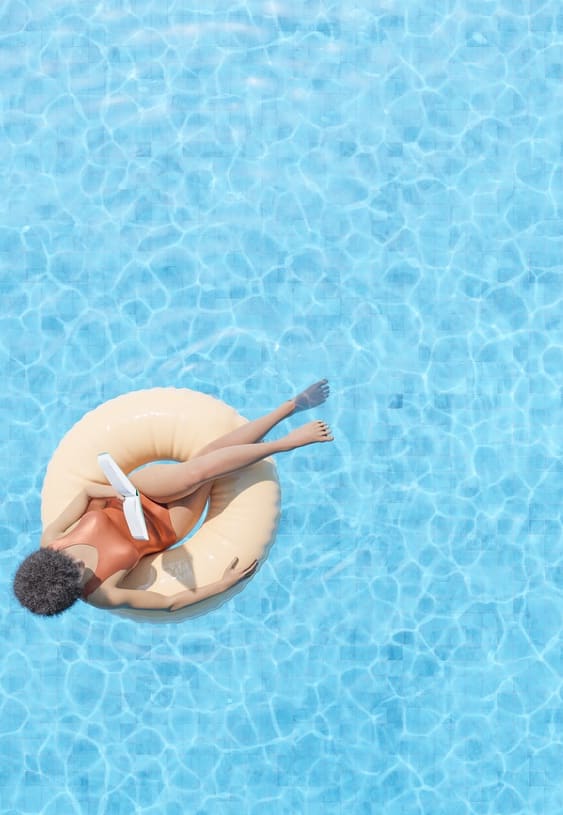 a woman in a swimming pool on a float