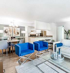 a living room with a couch and a glass table