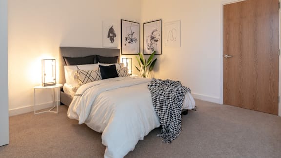 an example of a bedroom with a bed and a closet at The Keel Apartments, Liverpool, L3 4GE