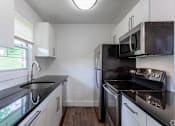 Thumbnail 5 of 9 - A kitchen with stainless steel