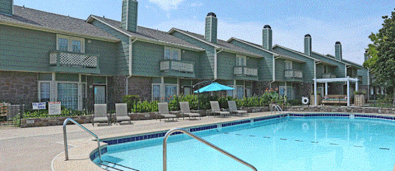 a house with a pool in front of it