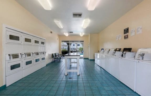 Laundry care facility with folding table