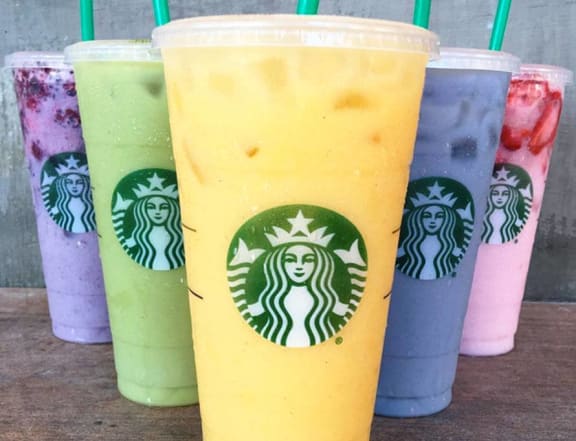 the lineup of drinks at starbucks including rainbow colored drinks