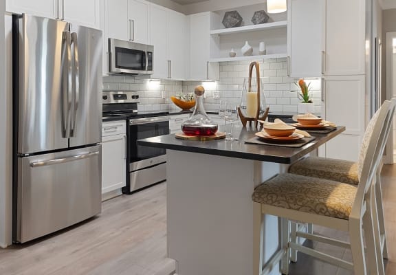 Kitchen with dining island at The Westlyn, Warrenville, IL, 60555