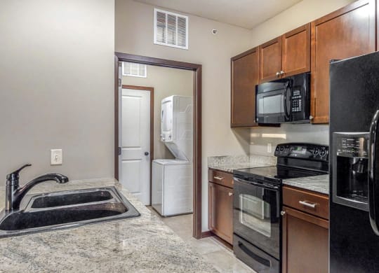A separate laundry room is located right off the kitchen in the 2 bedroom Ash at The Villas at Wilderness Ridge in southwest Lincoln NE 68512