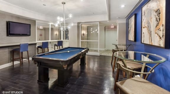 a game room with a pool table and a tv at The Chesapeake, Washington, DC 20008