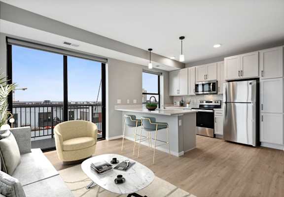 a kitchen and living room with a large window